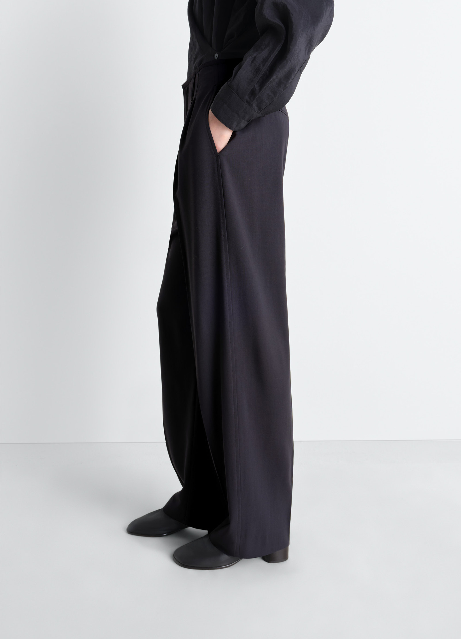 Soft tailored pants in wool crepe, model shot, side view relaxed fit
