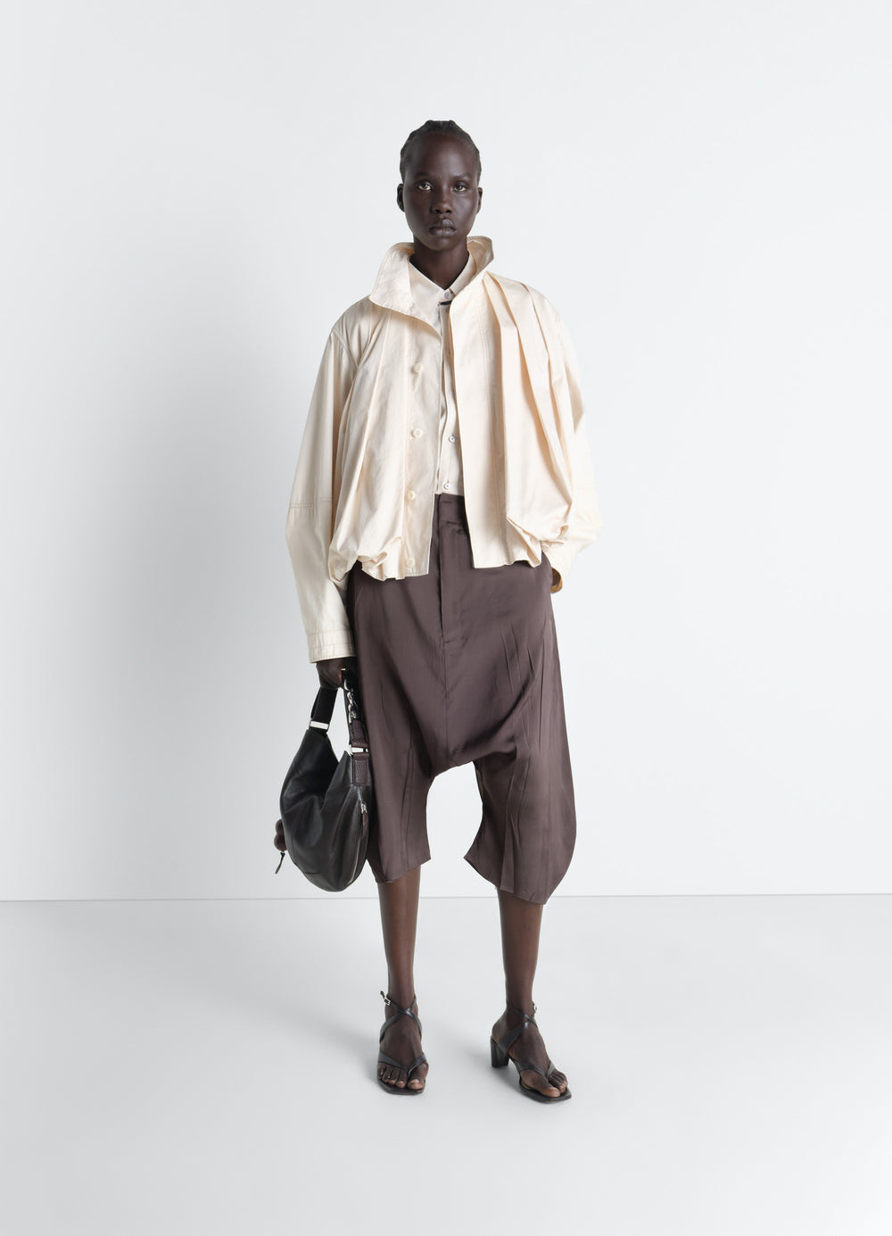 Creased Dropped Crotch Bermudas in Poly Viscose Twill, model shot, Front view Wide flowing volume