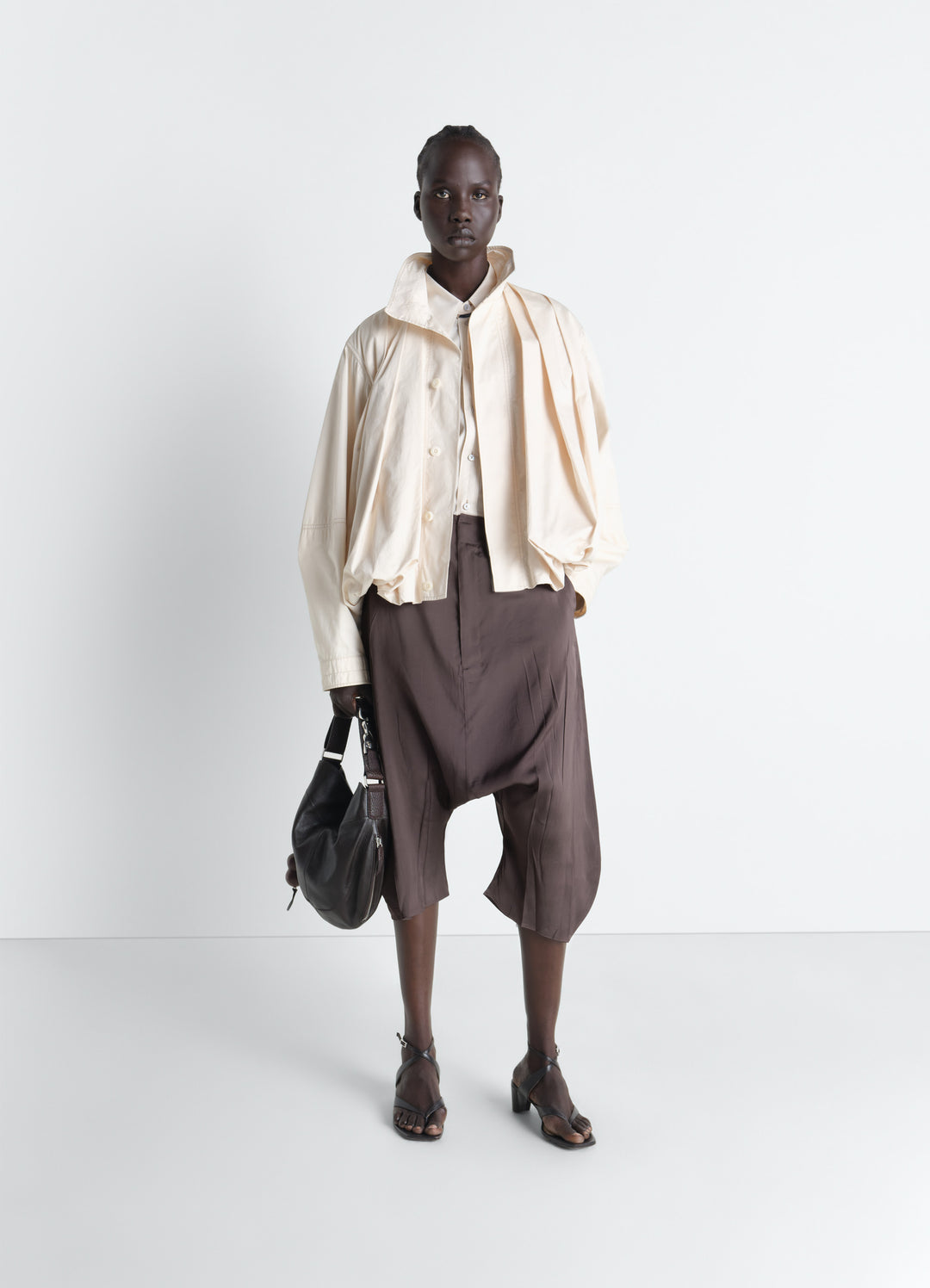 Creased Dropped Crotch Bermudas in Poly Viscose Twill, model shot, Front view Wide flowing volume