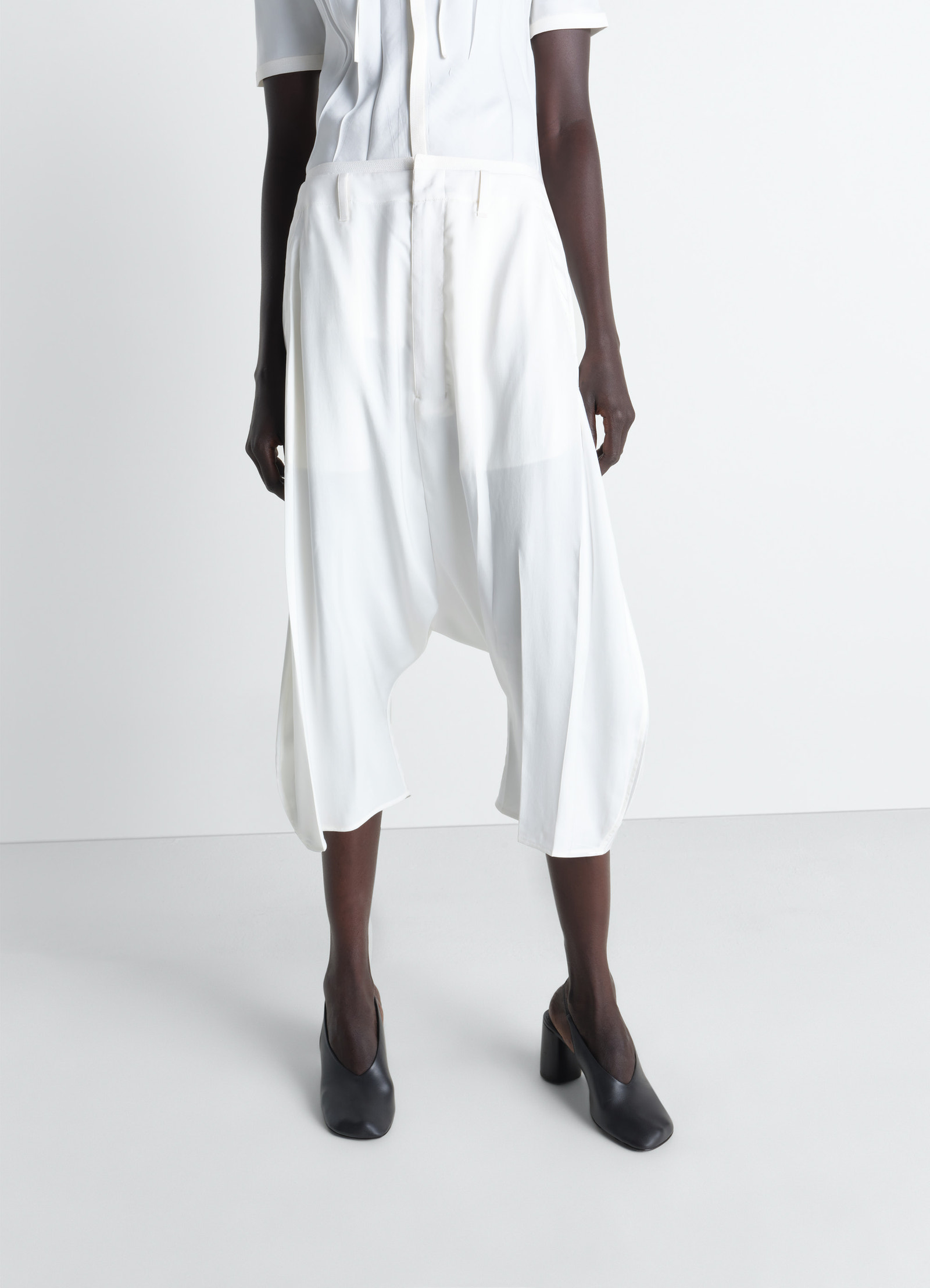 Creased dropped crotch bermudas in poly viscose twill