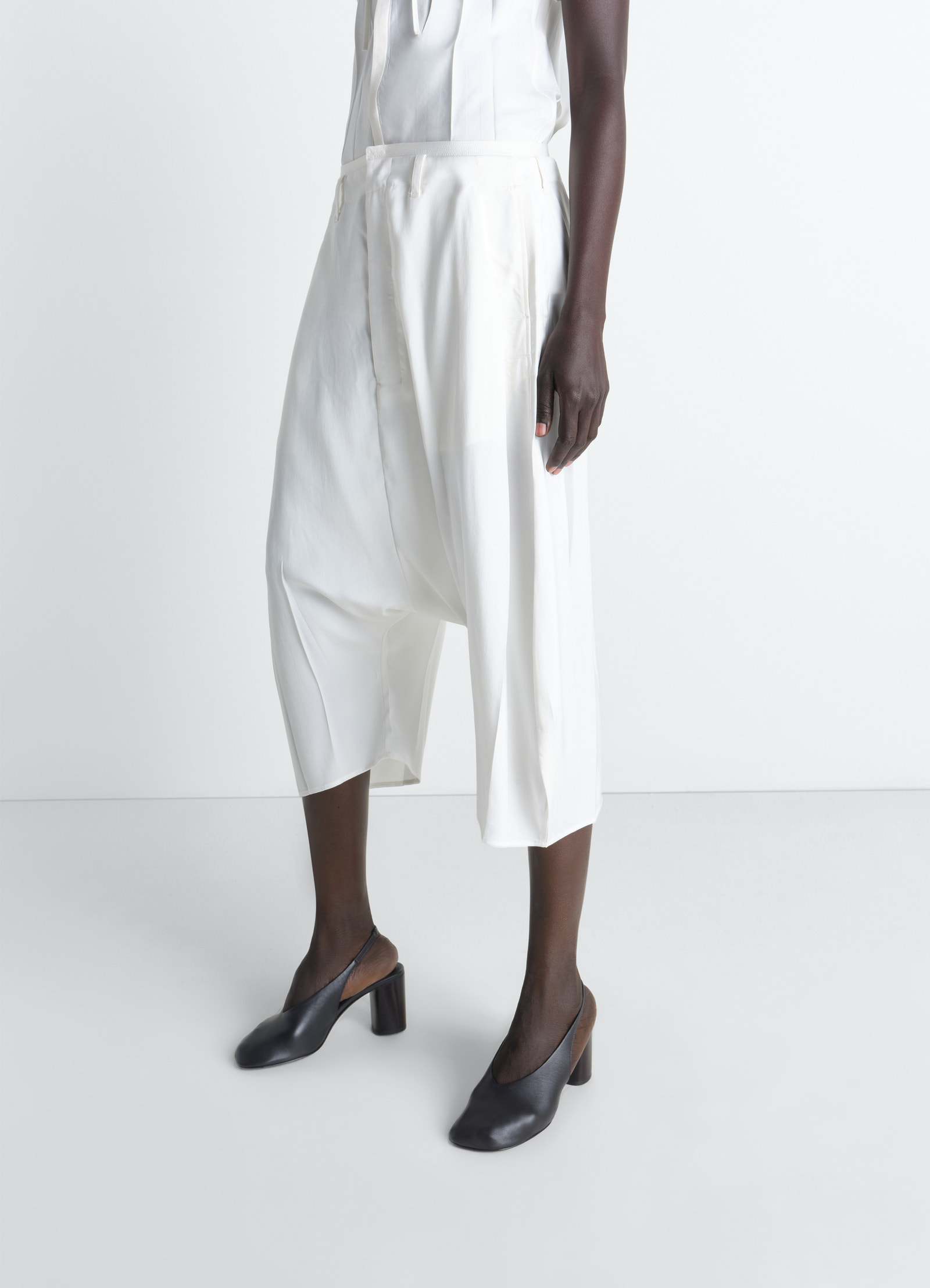 Creased dropped crotch bermudas in poly viscose twill