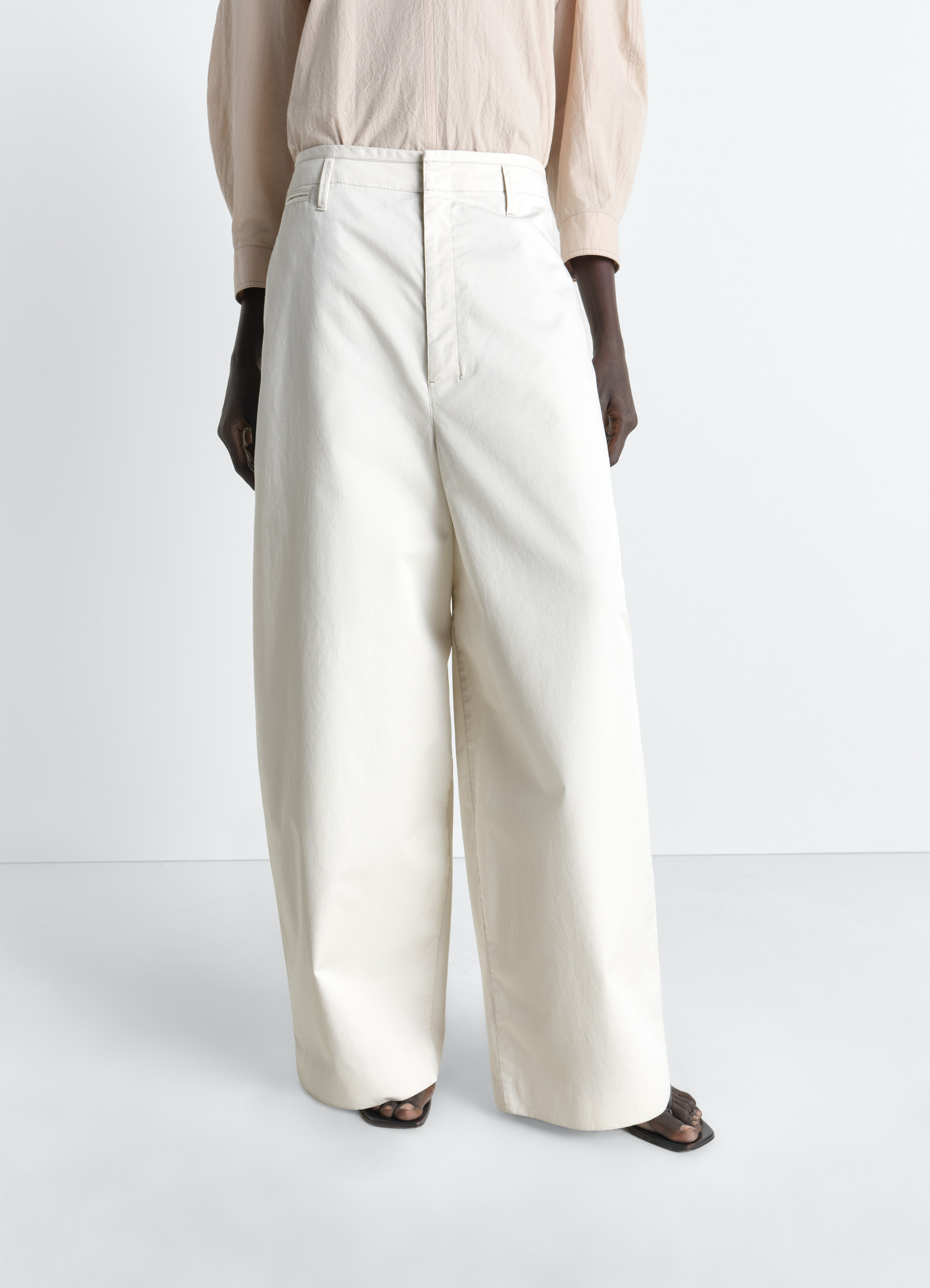 Lemaire large chino pants in cotton twill, model shot, side view high waist, wide leg