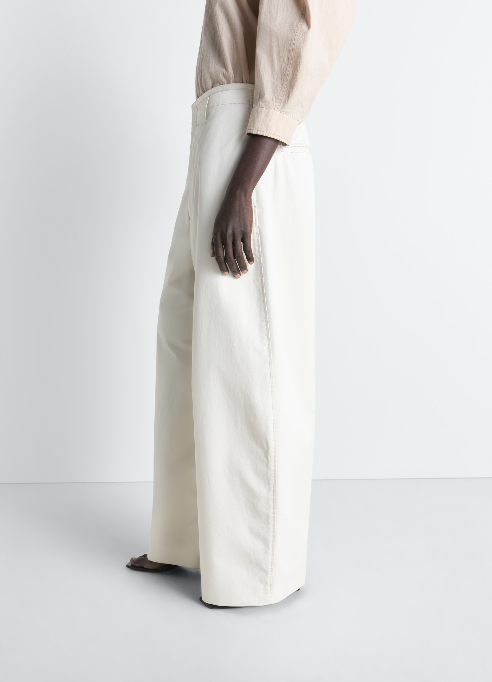 Lemaire large chino pants in cotton twill, model shot, three-quarter view wide leg silhouette
