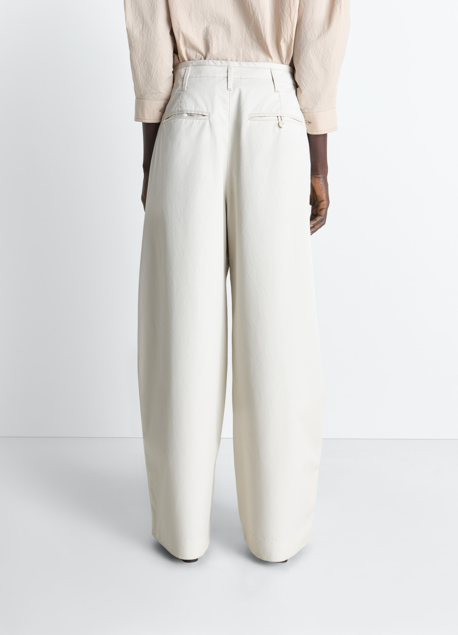 Lemaire large chino pants in cotton twill, model shot, back view double rear pockets