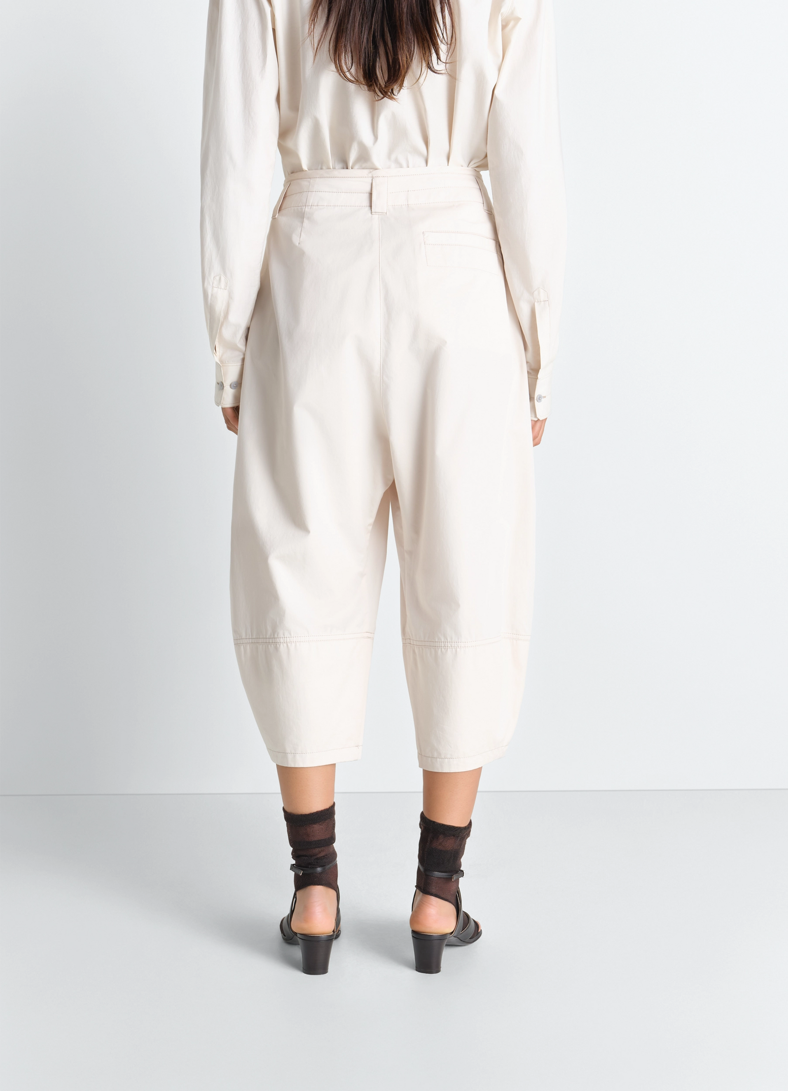 Volume bermudas in cotton satin, model shot, back full-body view loose fit draped hem