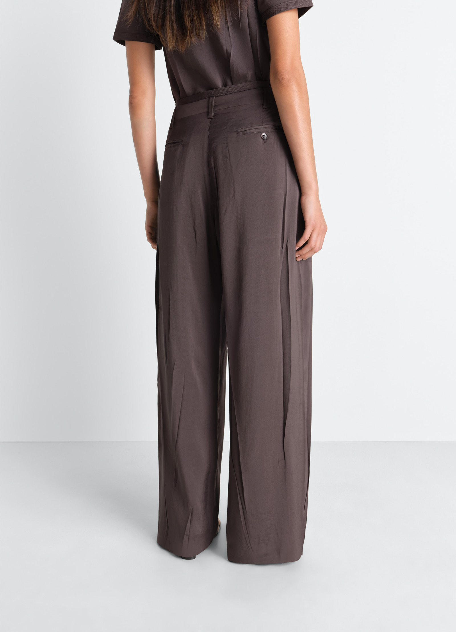 Creased soft pants in poly viscose twill, model shot, rear three-quarter view relaxed fit, belt loops