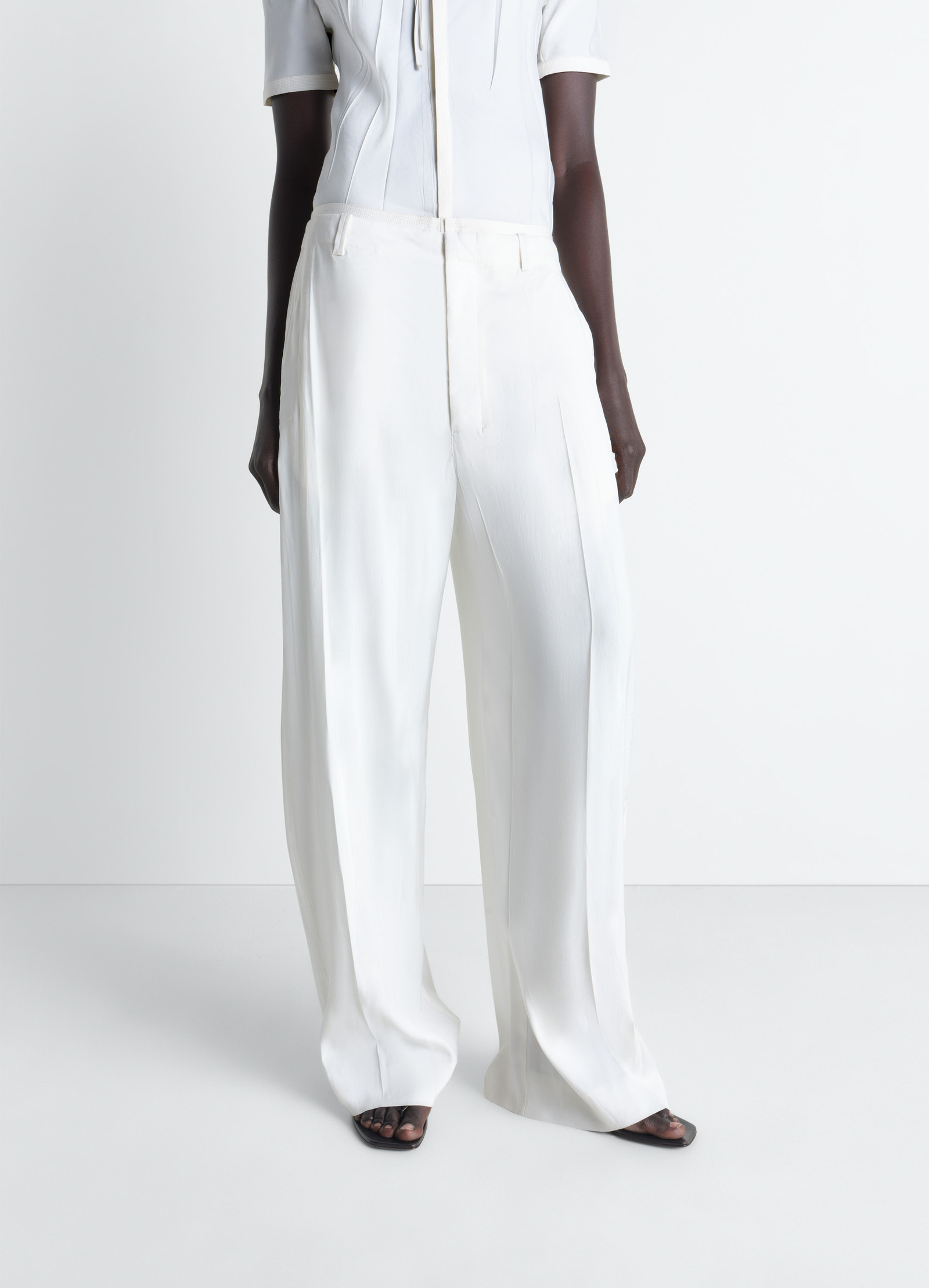 Creased soft pants in poly viscose twill, model shot, side view creased front detail