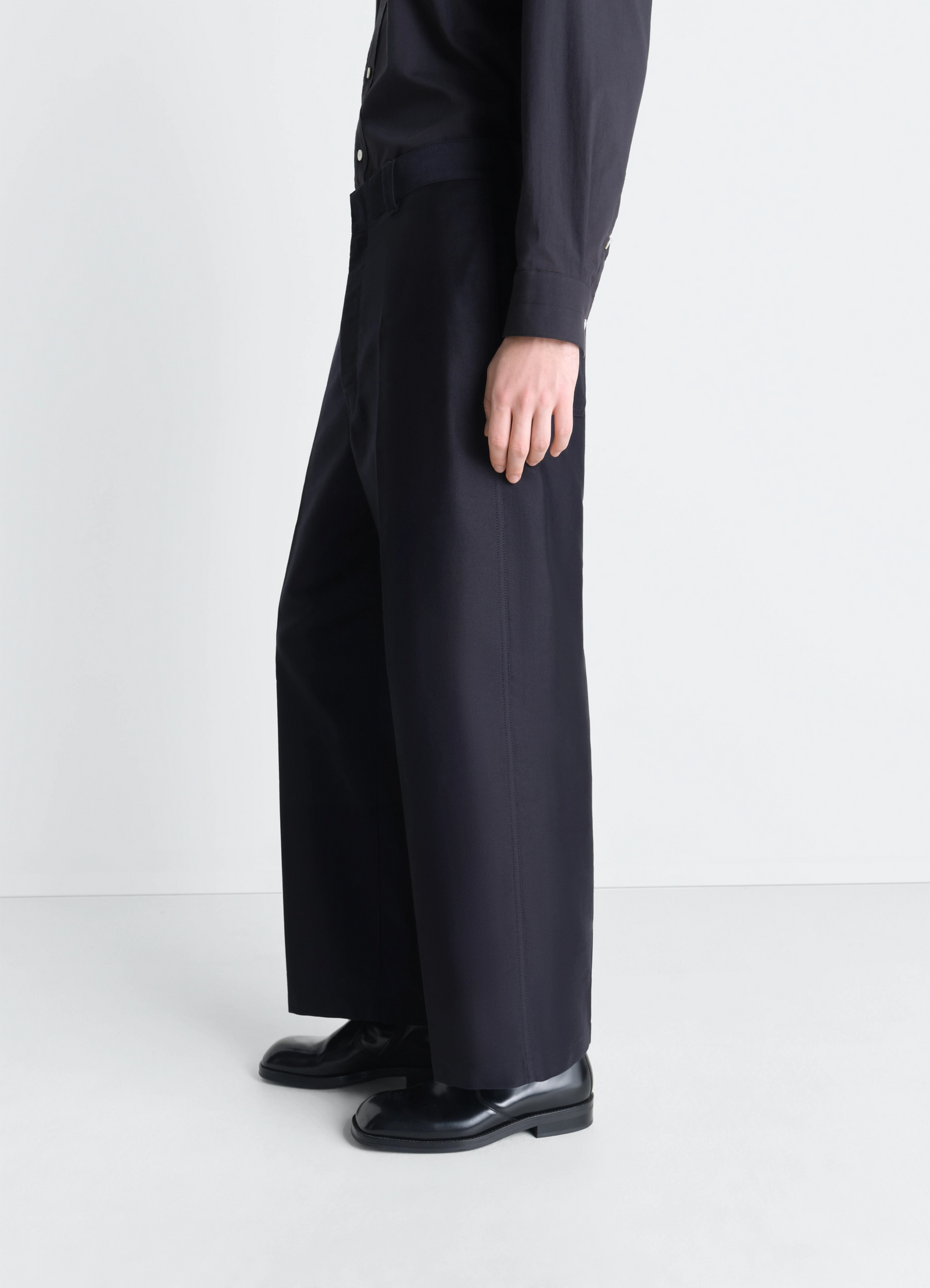 Lemaire wide workwear pants in cotton satin, model shot, side profile view straight leg, mid rise