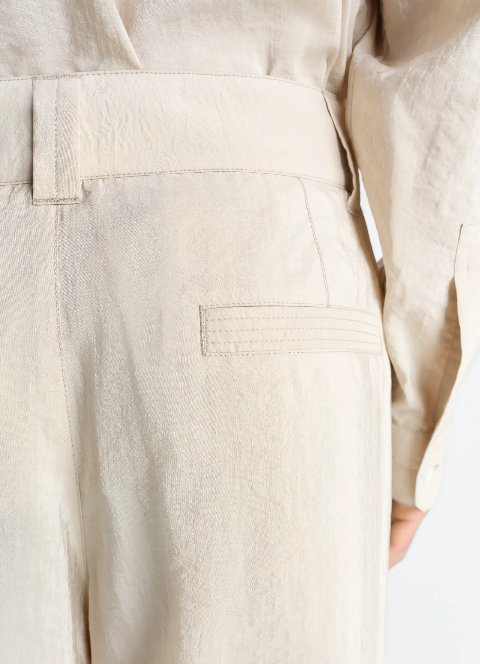 Straight tailored pants in dry silk, model shot, rear detail shot welt pocket design