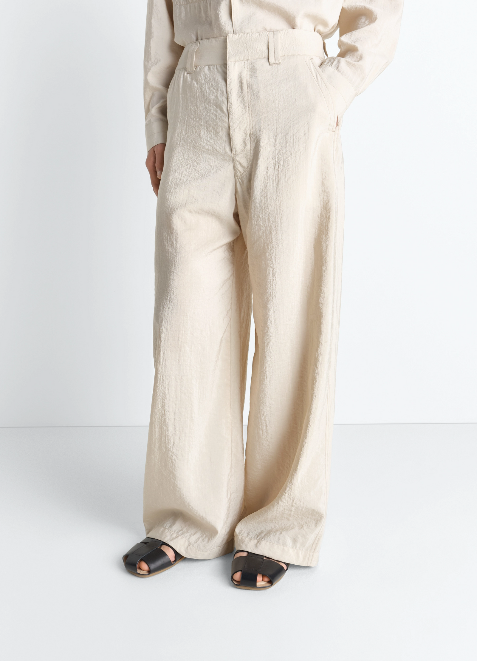 Straight tailored pants in dry silk, model shot, close-up view straight leg cut