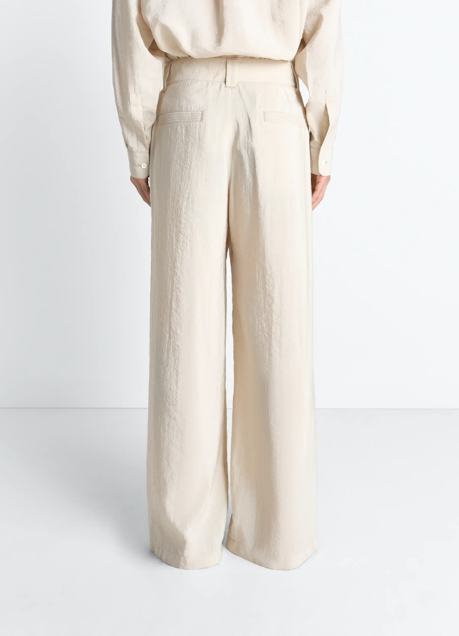 Straight tailored pants in dry silk, model shot, back view high waist with belt loops