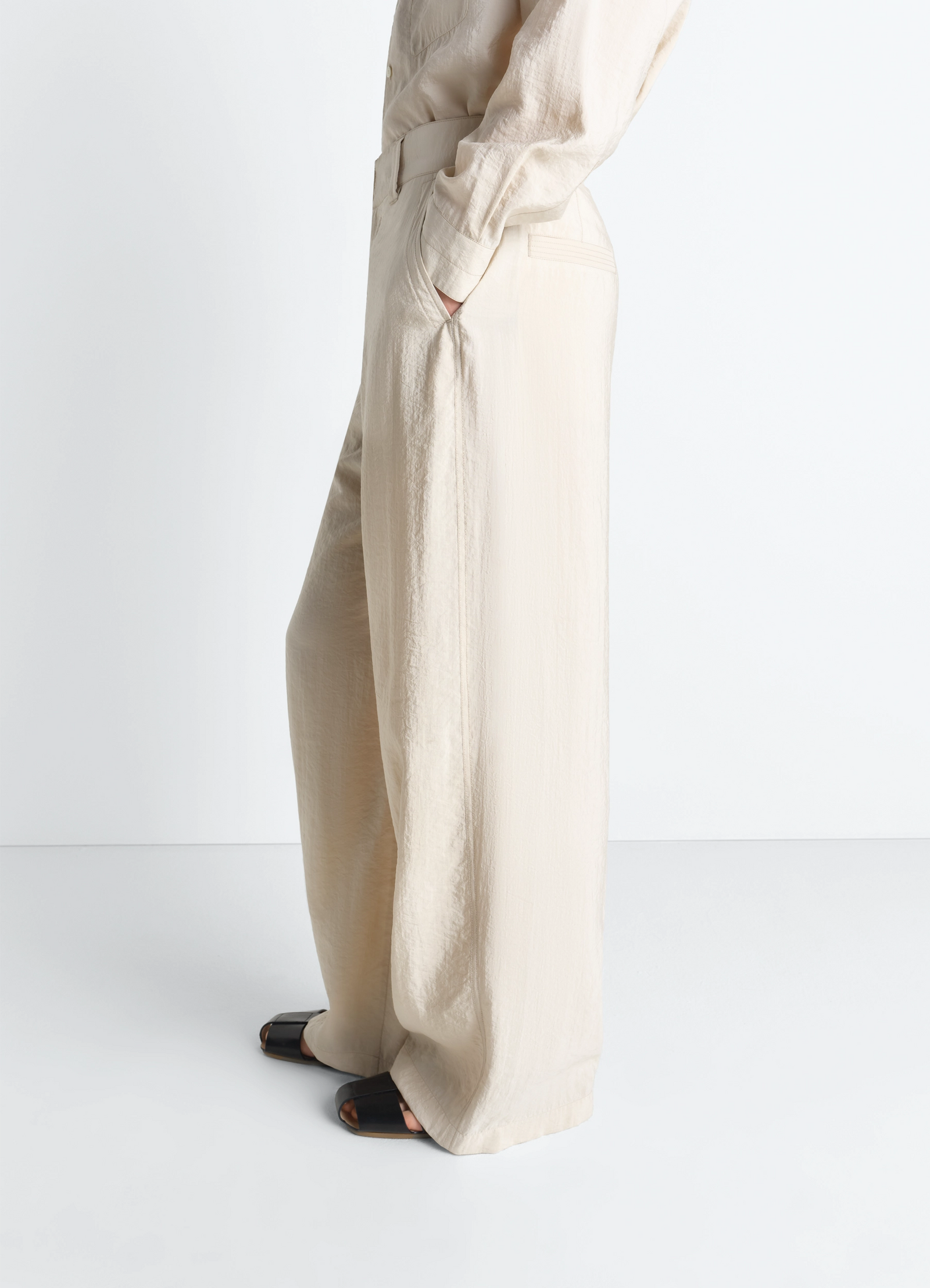 Straight tailored pants in dry silk, model shot, side view high waist