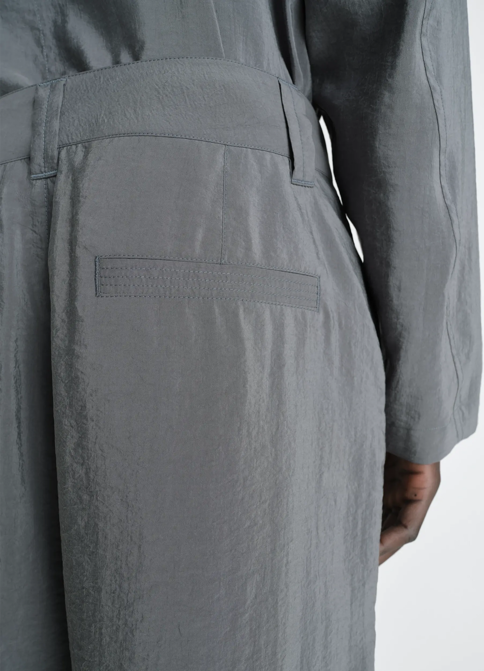 Straight tailored pants in dry silk, model shot, back detail view single rear pocket