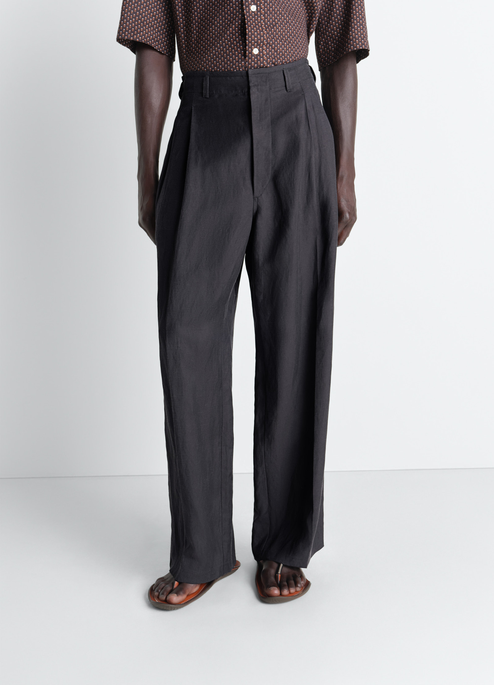 Pleated tailored pants in viscose linen gabardine, model shot, lower body front view high waist detail