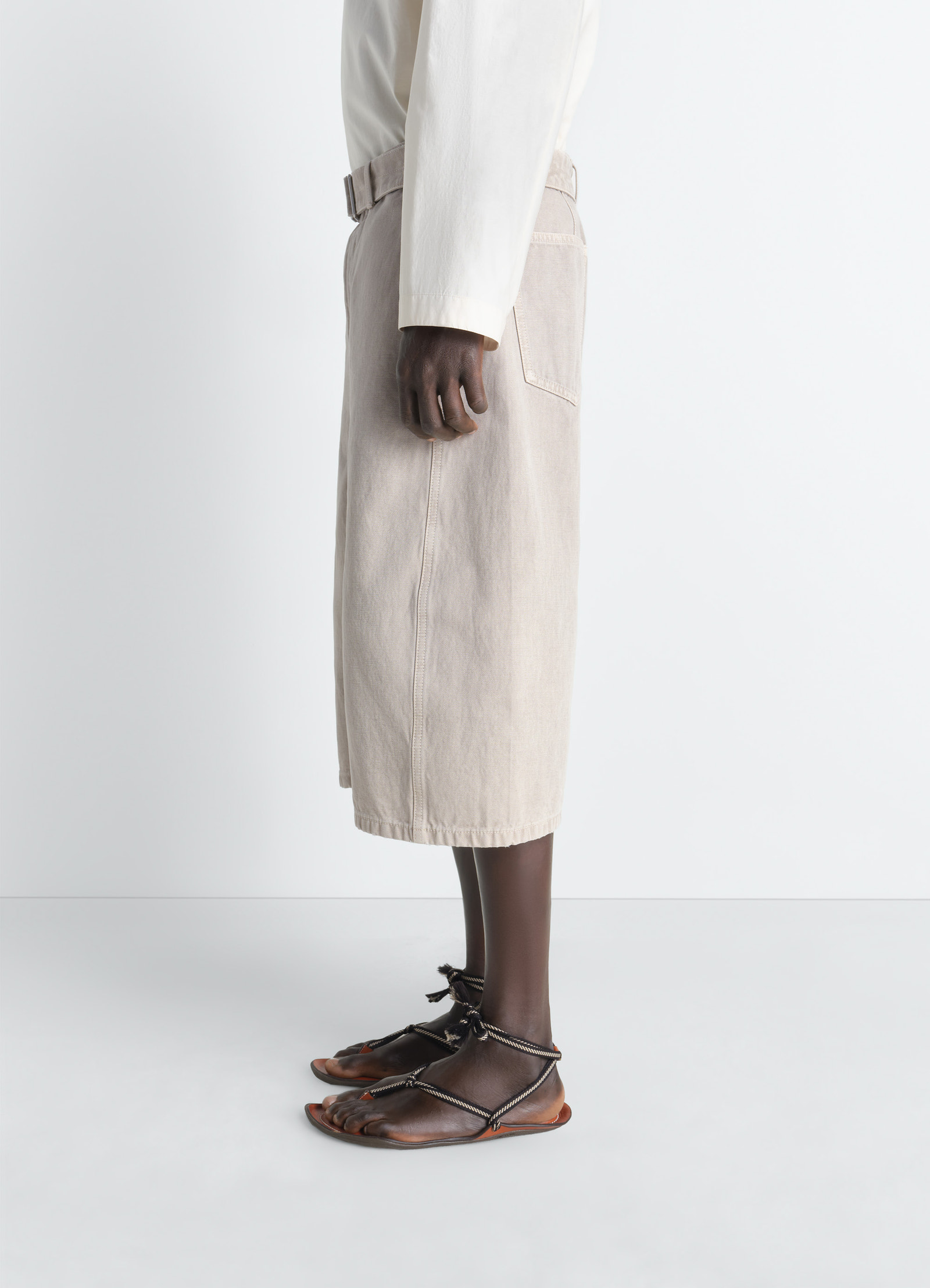 Denim short in heavy broken twill in snow, model shot, side view long length cut