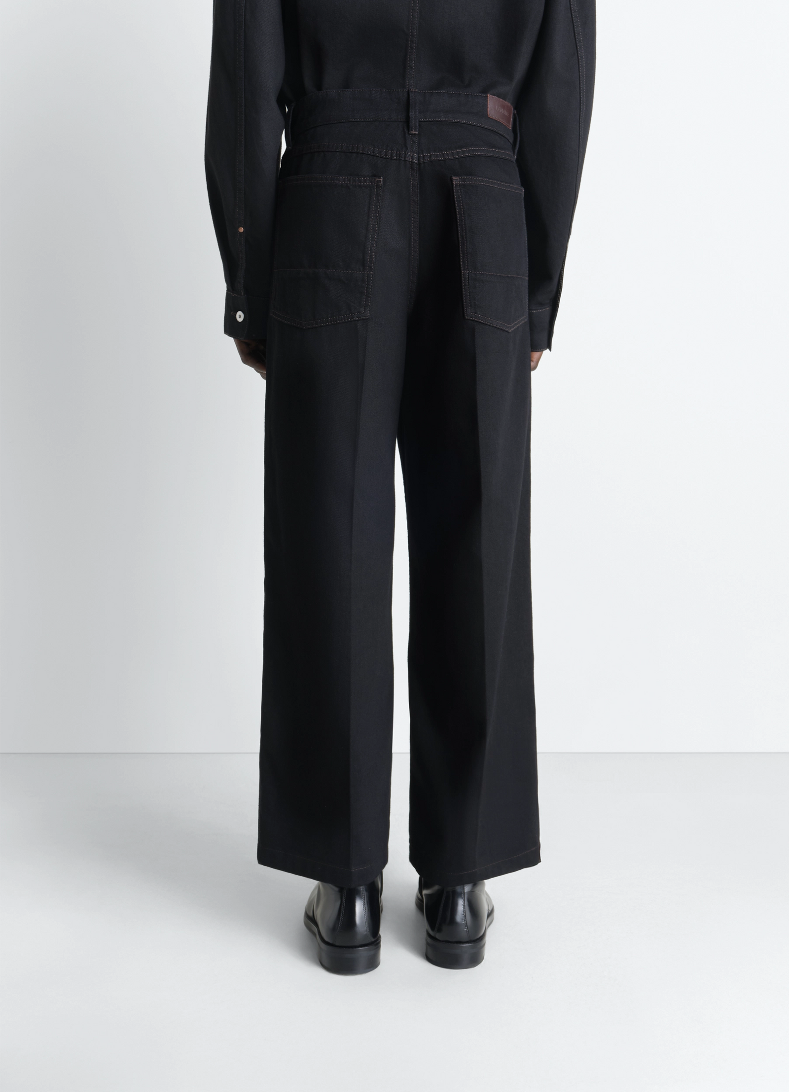 Lemaire wide pants in black denim, model shot, back view belt loop detail
