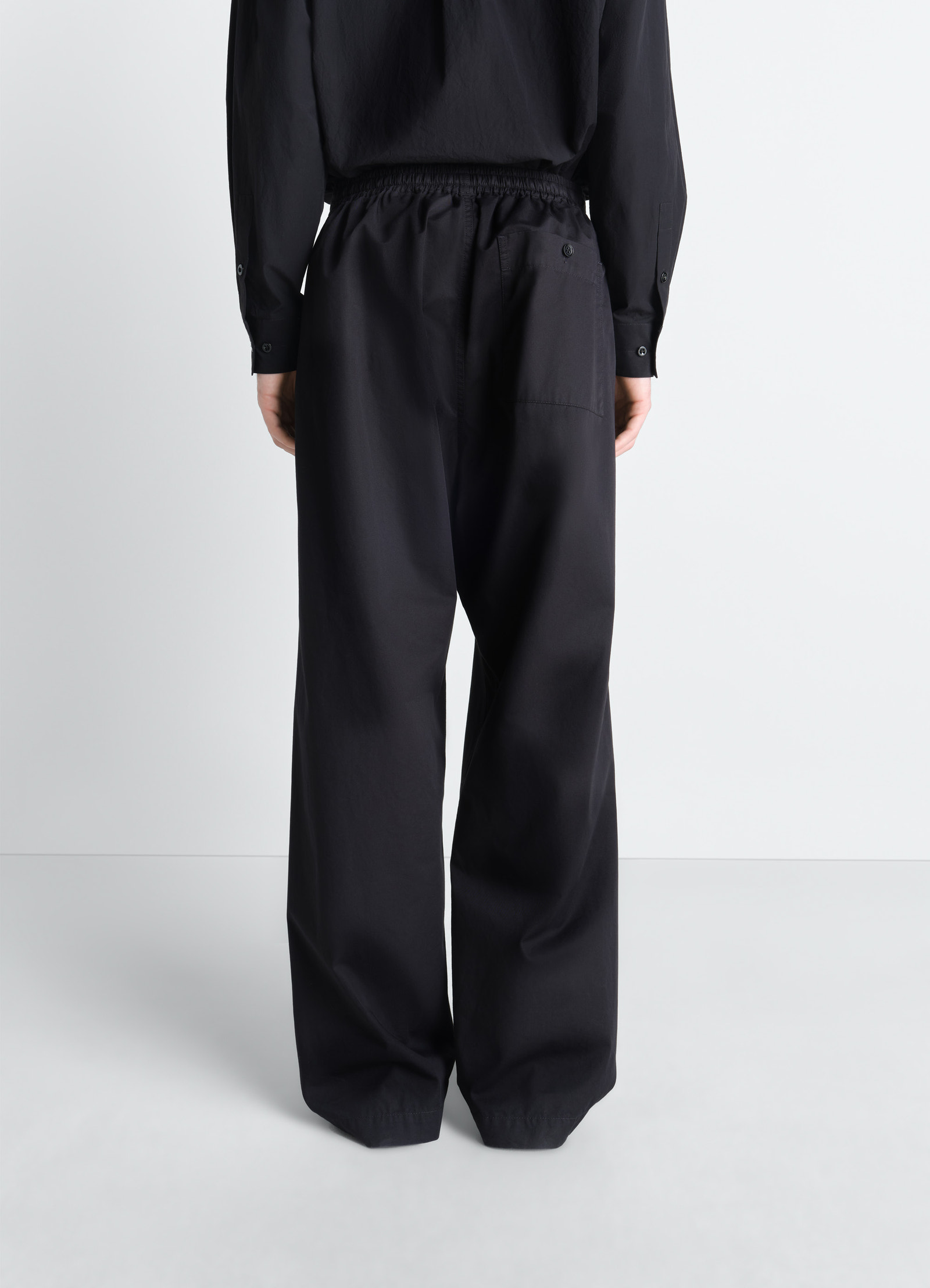 Lemaire pyjama pants in light cotton twill, model shot, rear view loose fit elastic waist