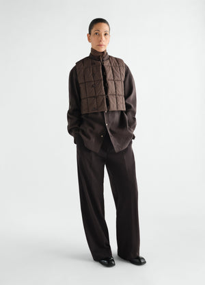 Wide pleated wool gabardine pants in dark brown worn by model lemaire front view styled look