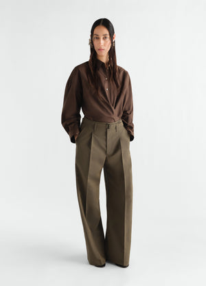 Wide pleated wool mohair pants in olive brown worn by model front shot lemaire
