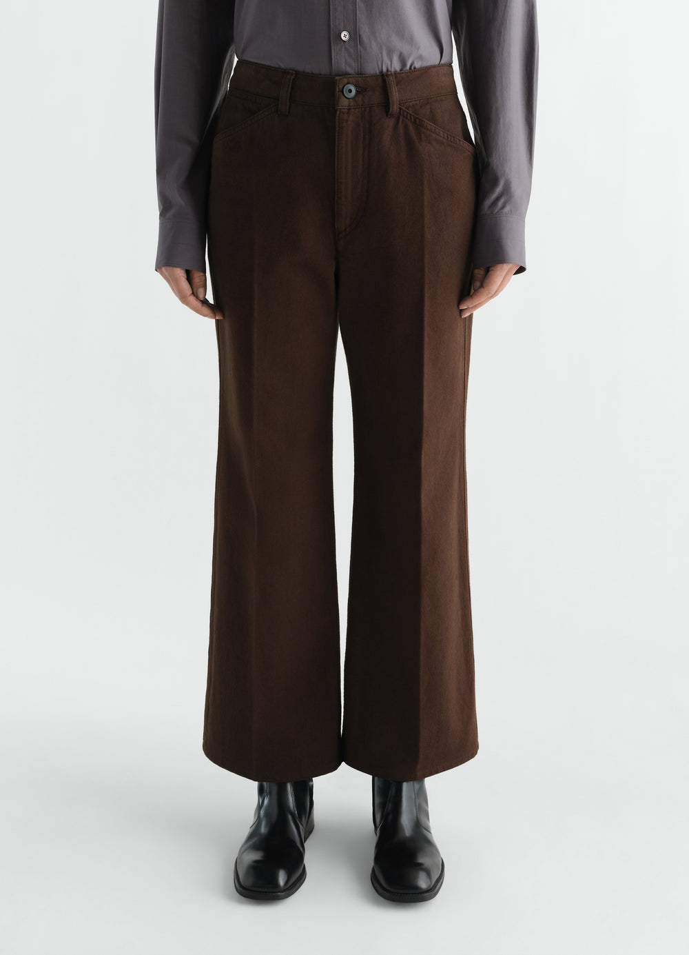 Flared brown cotton twill pants LEMAIRE worn by model front view with black boots and grey shirt