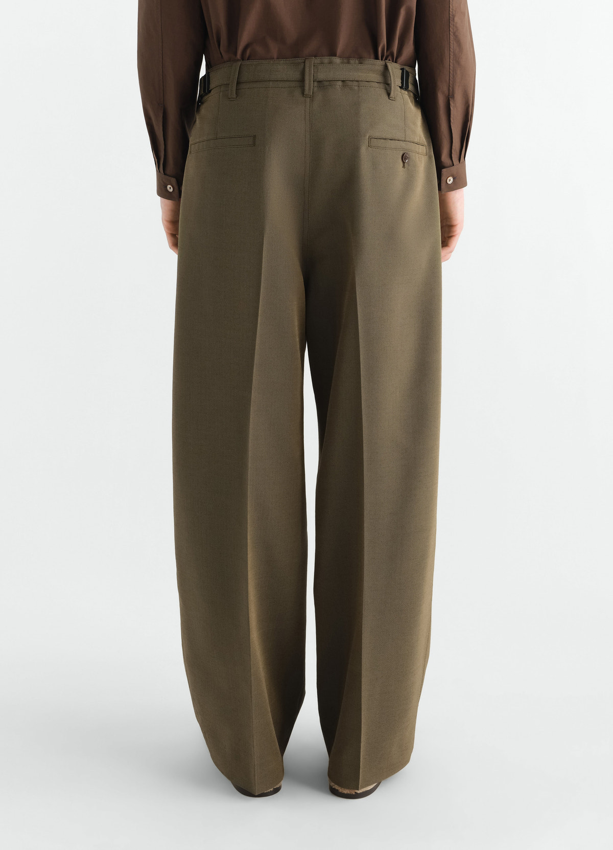 Single-pleat tailored wool mohair pants in khaki green by lemaire back view worn by a model