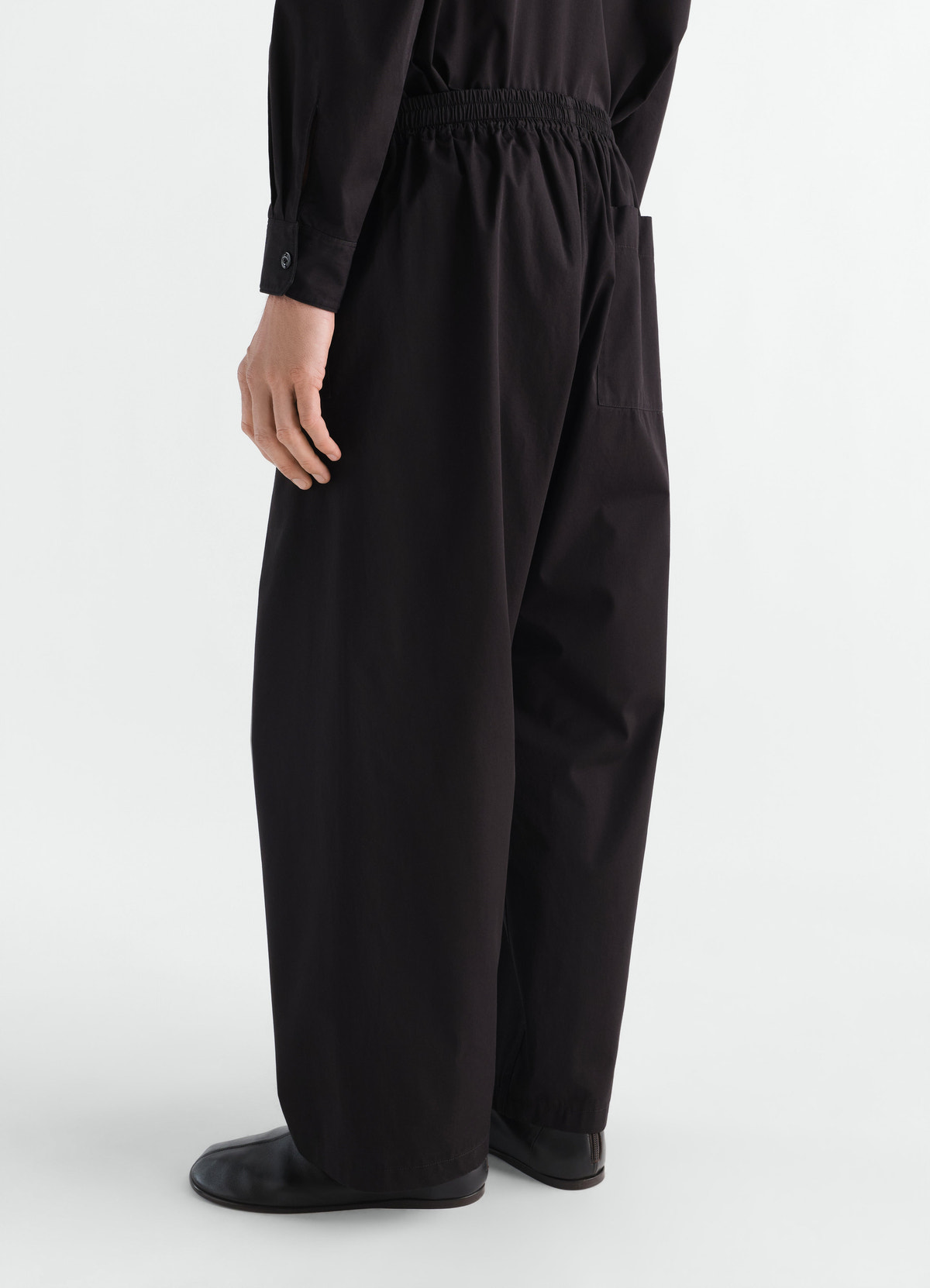 Pyjama pants in black light cotton twill with elastic waist by lemaire worn by model back view