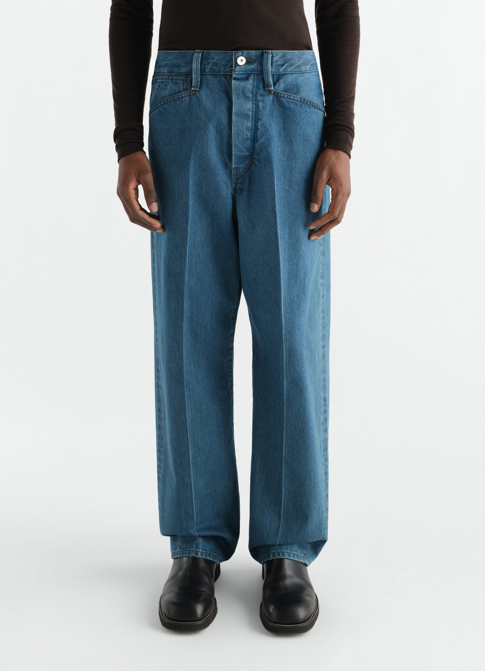 Straight indigo selvedge denim five-pocket pants worn by model front view lemaire