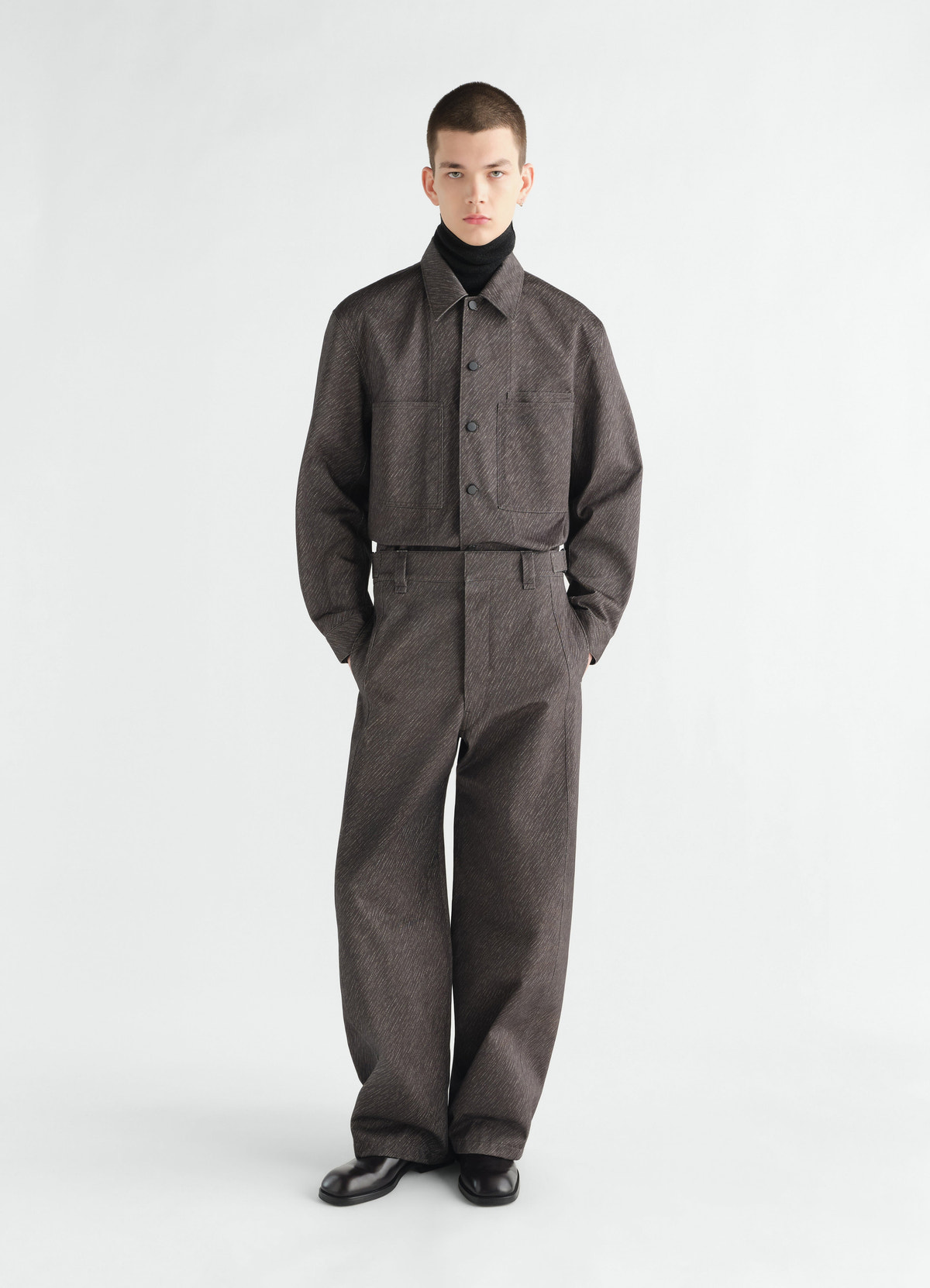 Maxi pants in brown diagonal printed cotton lemaire worn by a model front view with matching jacket and black turtleneck