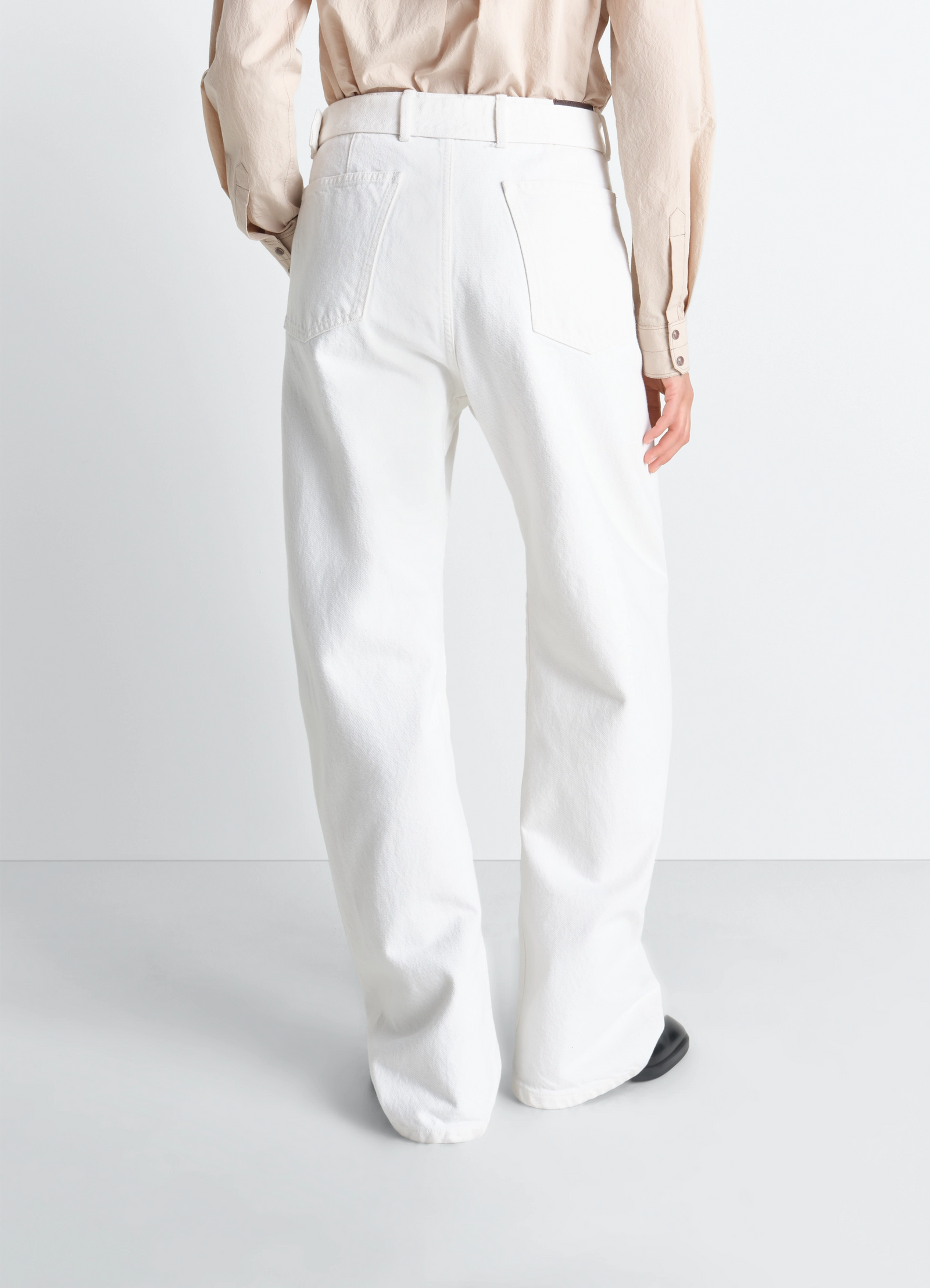 Twisted belted pants in denim in bleached denim, model shot, back view belted high waist view 6