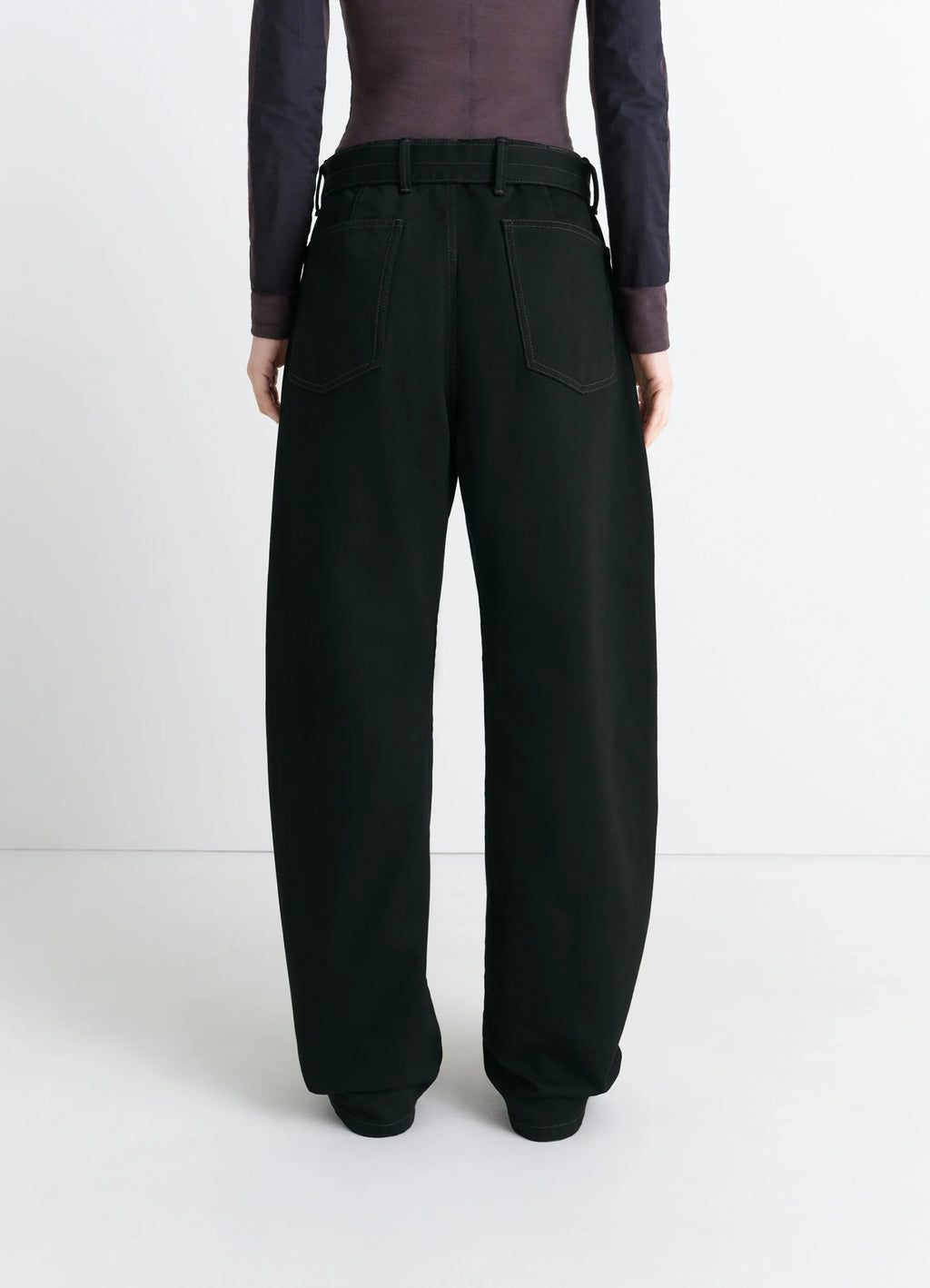 Lemaire Twisted Belted Pants in Deep Black Thick Denim, model shot, back view belted waist, patch pockets