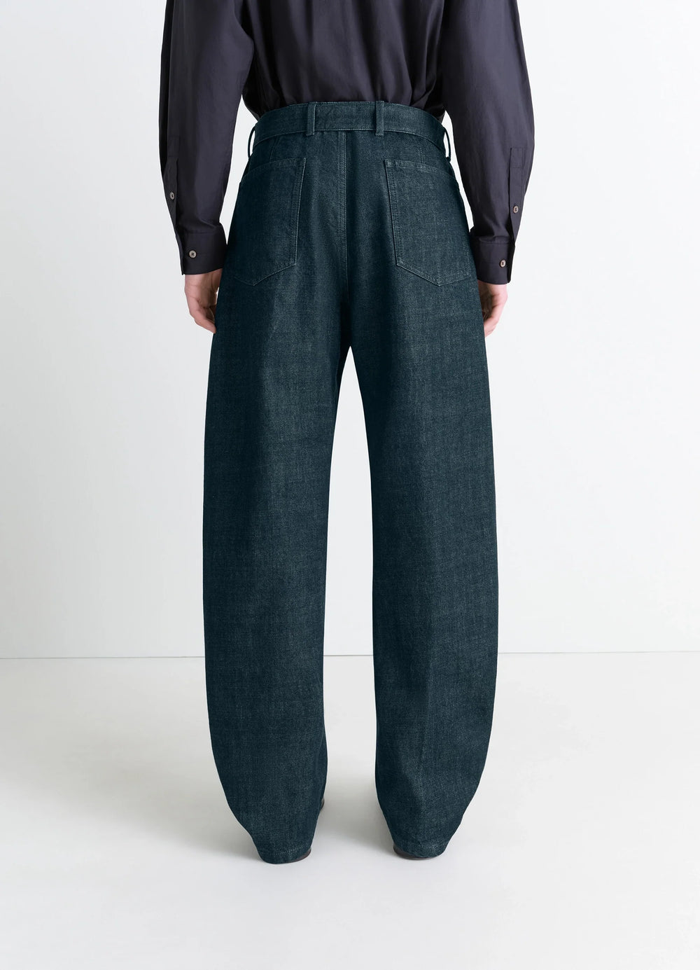 Lemaire Twisted Belted Pants in Deep Indigo Heavy Denim, model shot, back view straight leg back shot