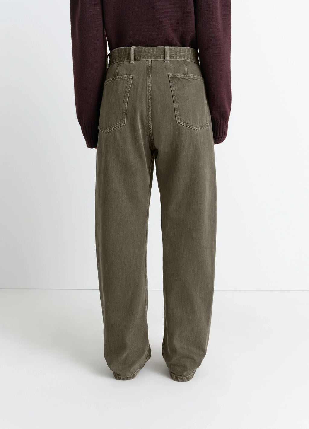 Lemaire Twisted Belted Pants in Snowy Patina Thick Denim, model shot, back close-up cinched cuff unisex