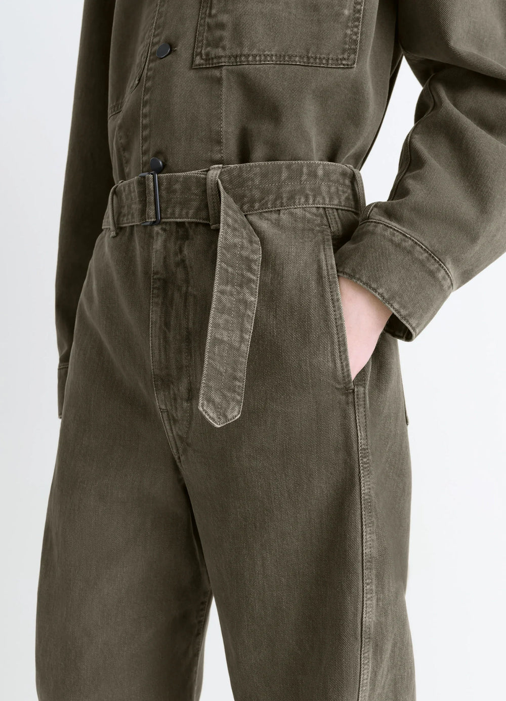 Lemaire Twisted Belted Pants in Snowy Patina Thick Denim, model shot, detail shot belted waist close-up