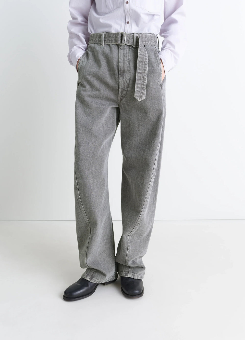 Lemaire Twisted Belted Pants in Snowy Patina Thick Denim, model shot, three-quarter view loose fit with belt
