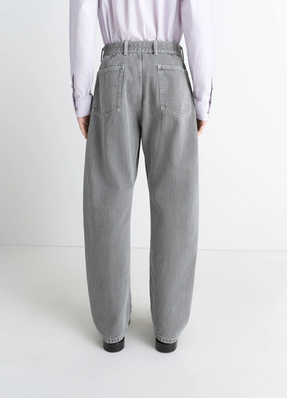 Lemaire Twisted Belted Pants in Snowy Patina Thick Denim, model shot, back view high waist, casual fit