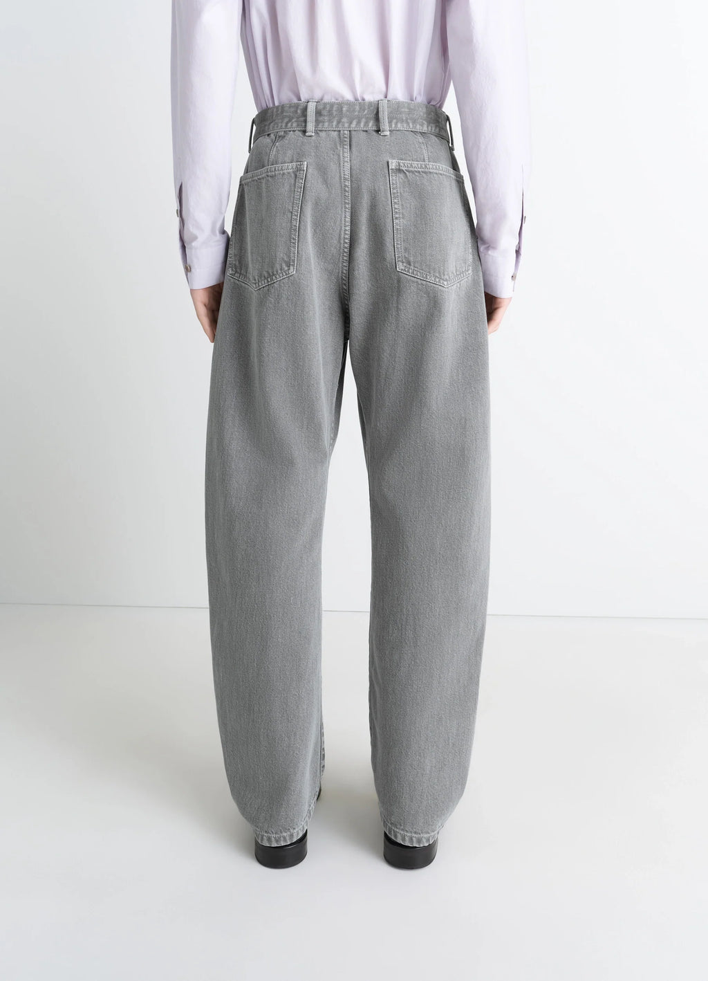 Lemaire Twisted Belted Pants in Snowy Patina Thick Denim, model shot, back view high waist, casual fit