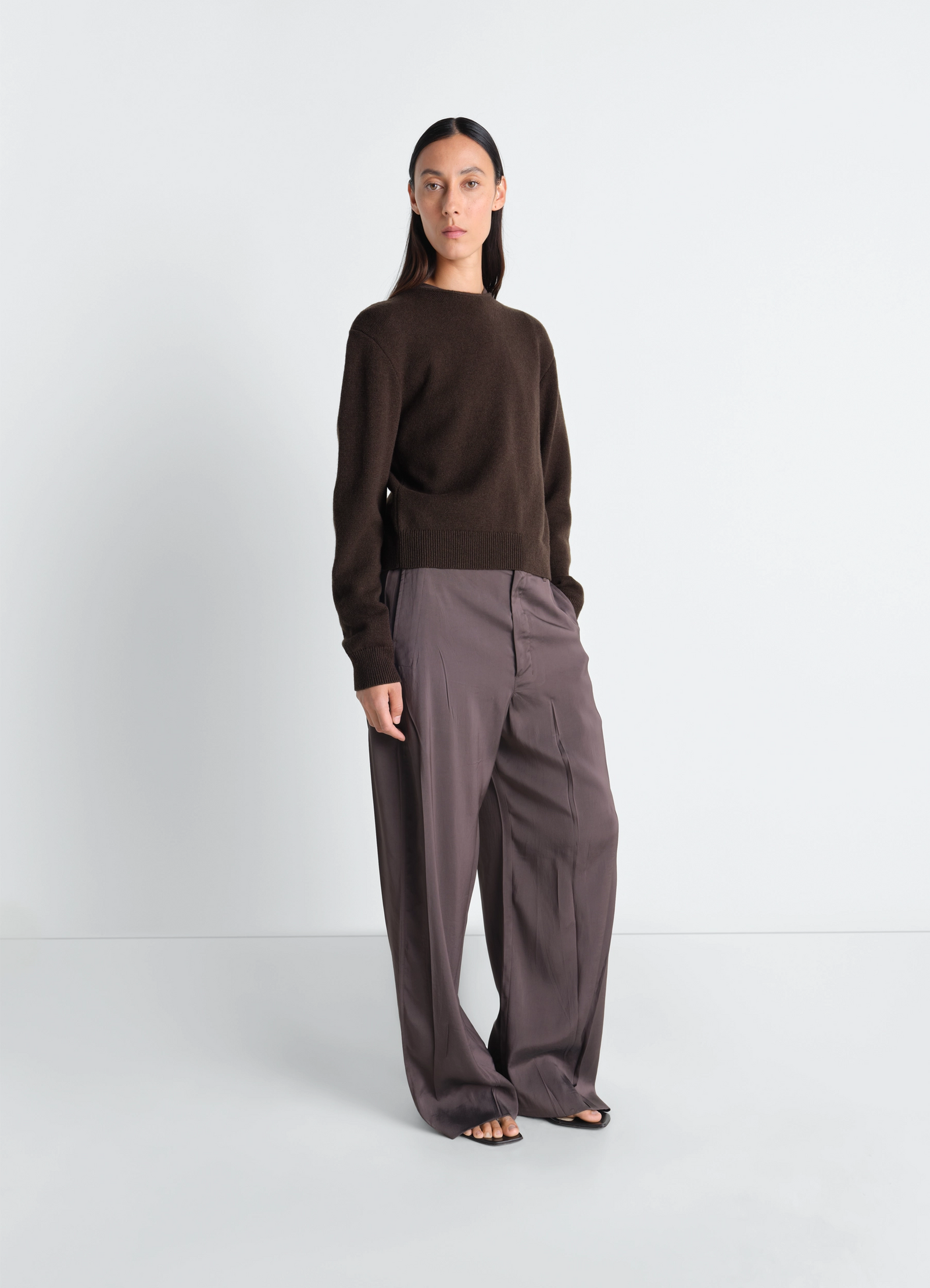Lemaire reversible buttoned sweater in cashmere wool, model shot, three-quarter view crew-neck worn unbuttoned