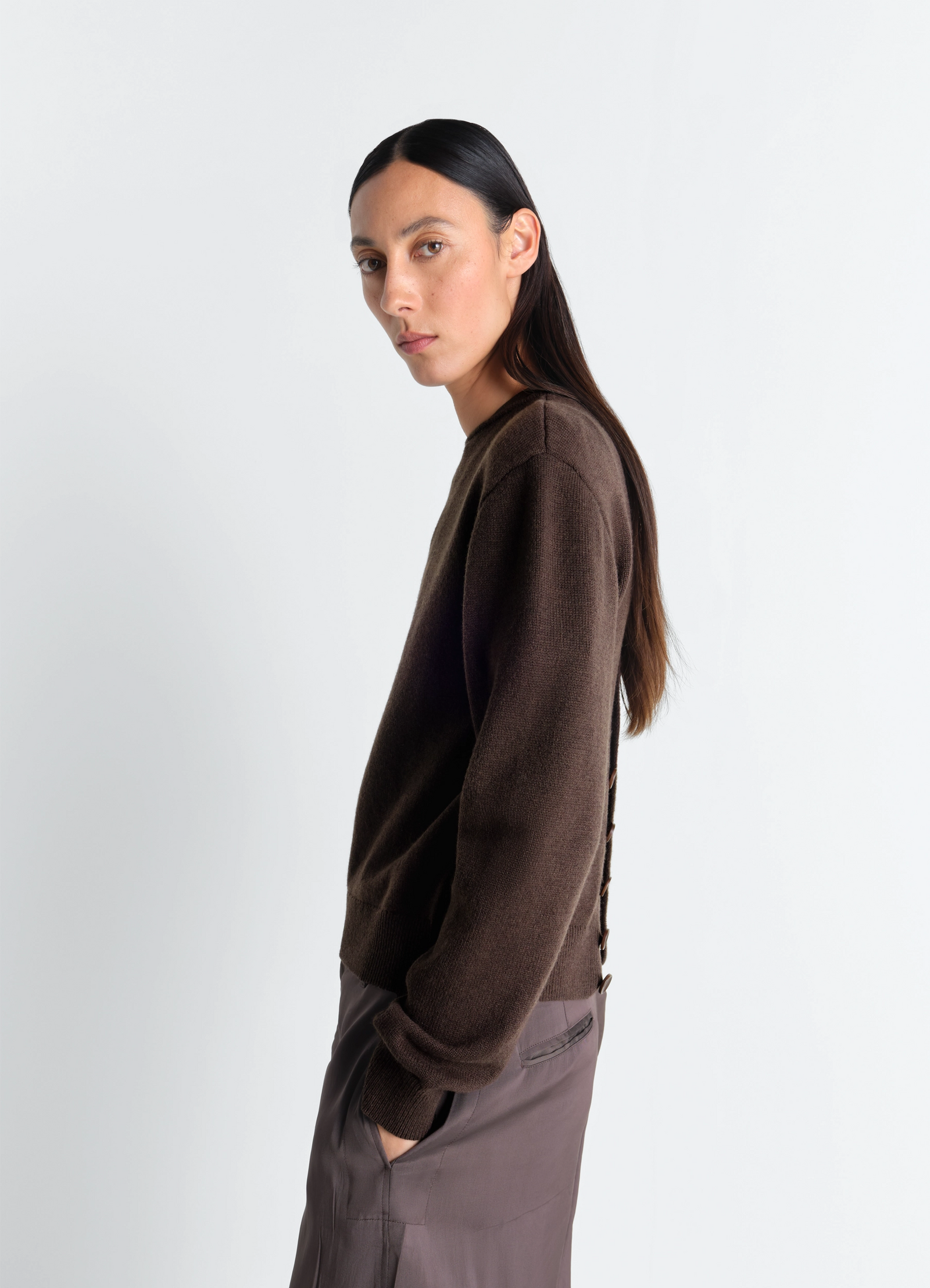 Lemaire reversible buttoned sweater in cashmere wool, model shot, side view worn buttoned back
