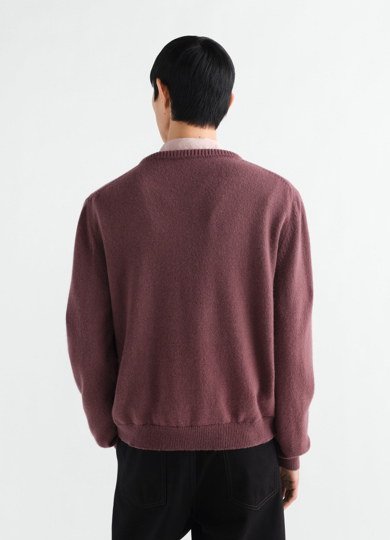 Crew-neck sweater lemaire in dusty purple alpaca wool blend, back view worn by model on white background