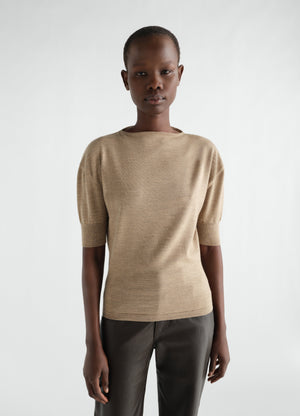 Short-sleeve beige fine merino wool sweater by lemaire worn by a model front view