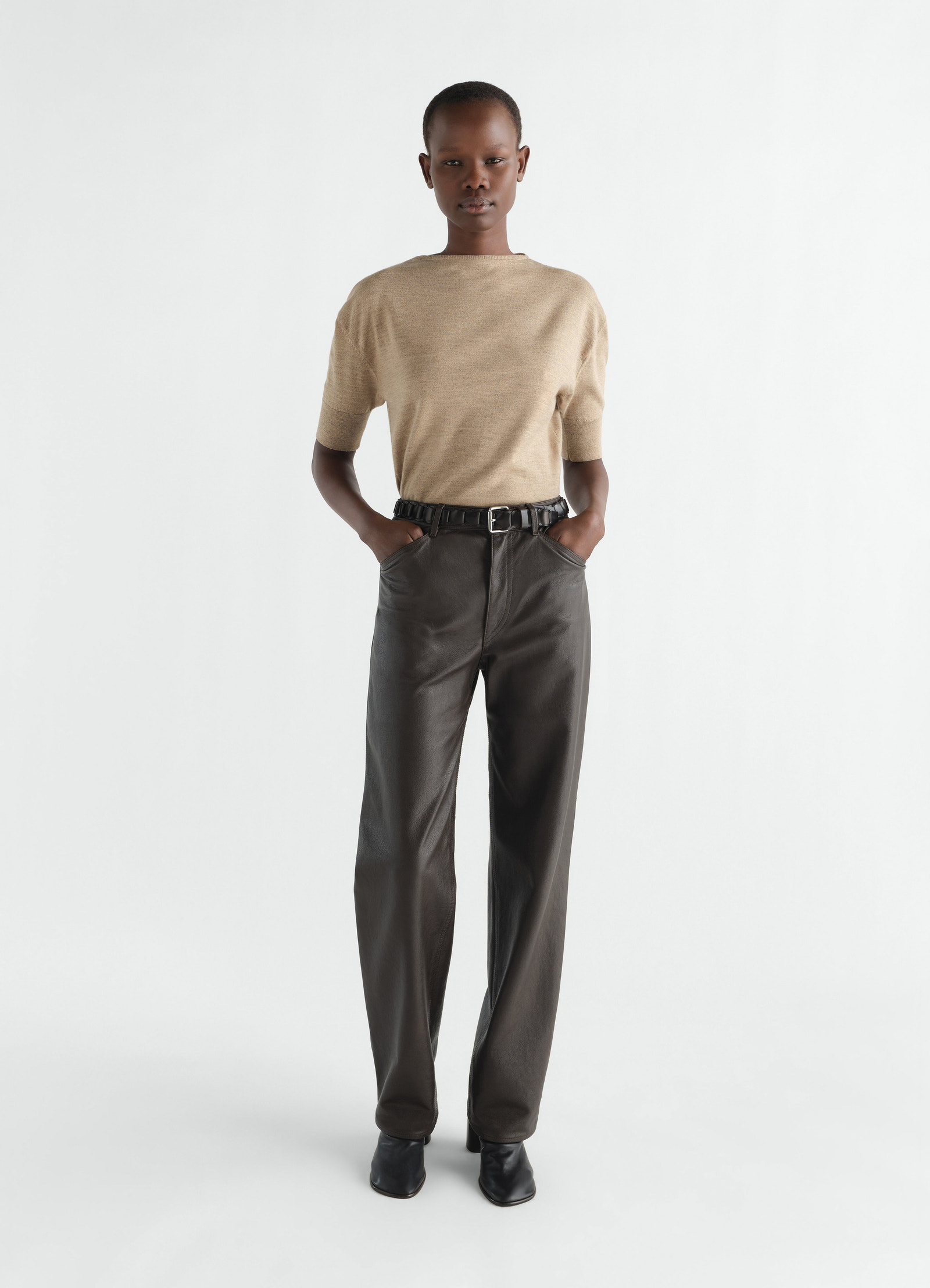 Short-sleeve beige fine merino wool sweater by lemaire worn by model front view on white background