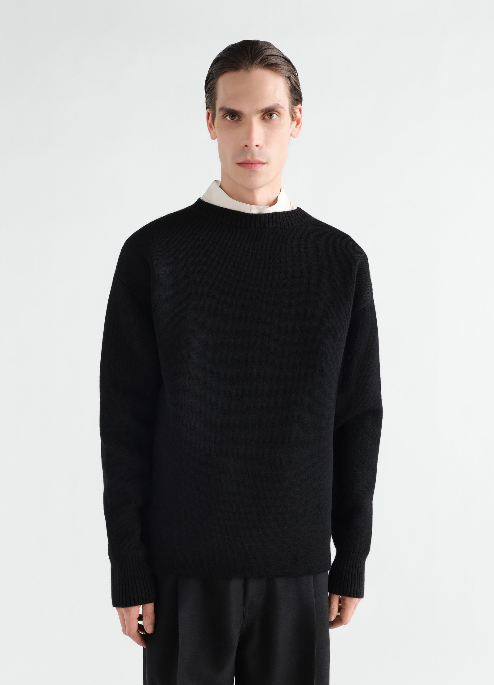 Boat-neck black double-face virgin wool sweater lemaire worn by a model front view