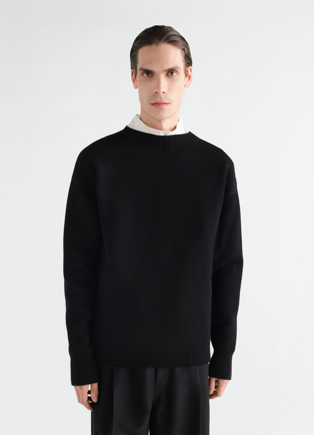 Boat-neck black double-face virgin wool sweater LEMAIRE worn by a model front view