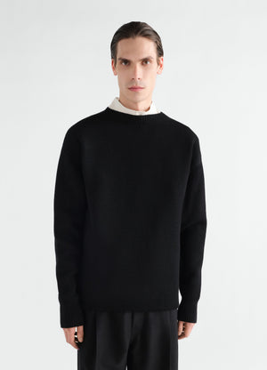 Boat-neck black double-face virgin wool sweater lemaire worn by a model front view