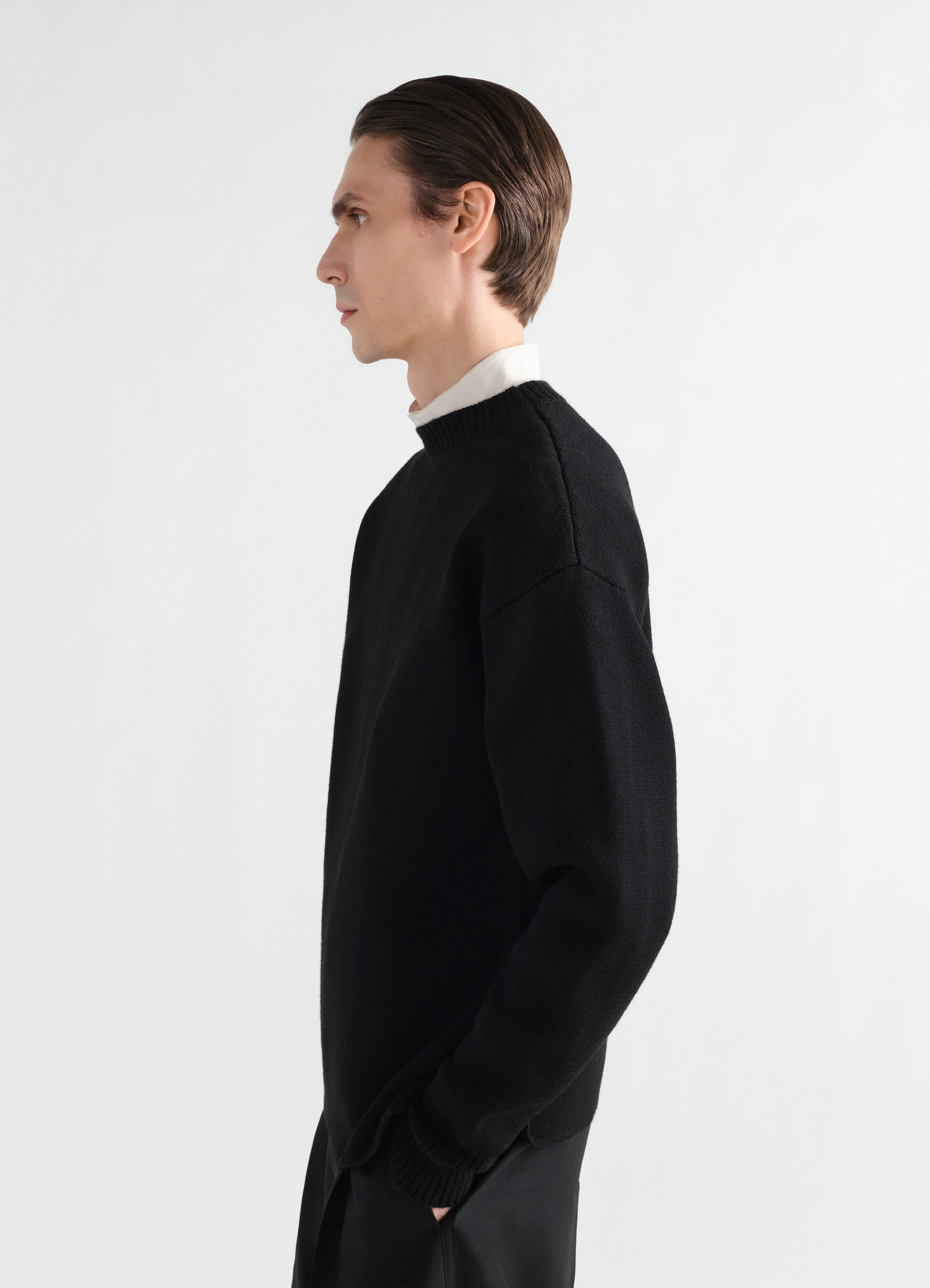 Boat-neck black double-face virgin wool sweater lemaire worn by model side view