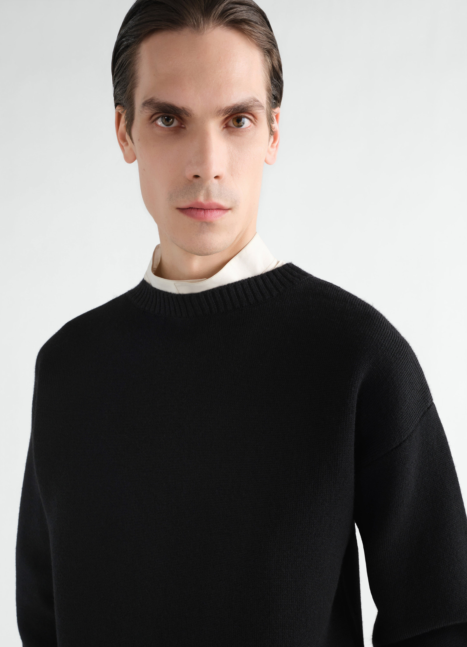 Boat-neck black double-face virgin wool sweater lemaire worn by model front close-up
