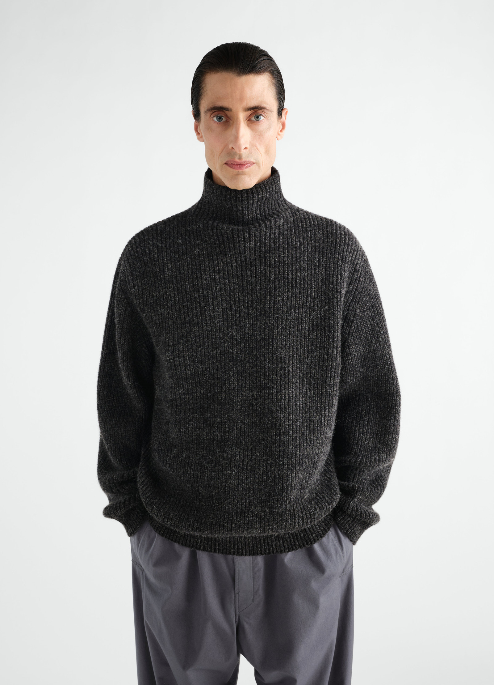 High neck dark grey yak alpaca sweater lemaire worn by model front view