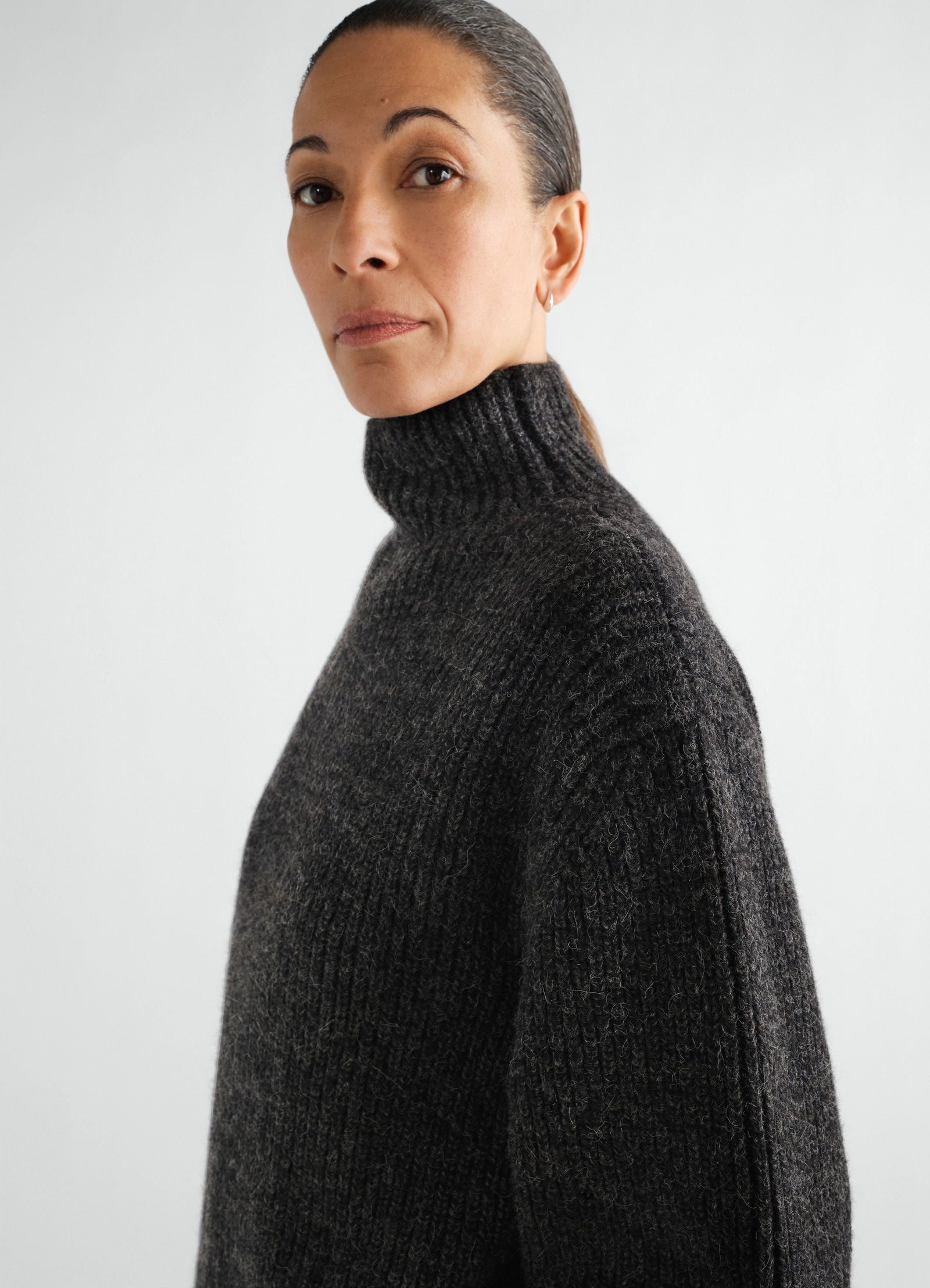 High neck dark grey yak alpaca sweater lemaire worn by model side view close-up