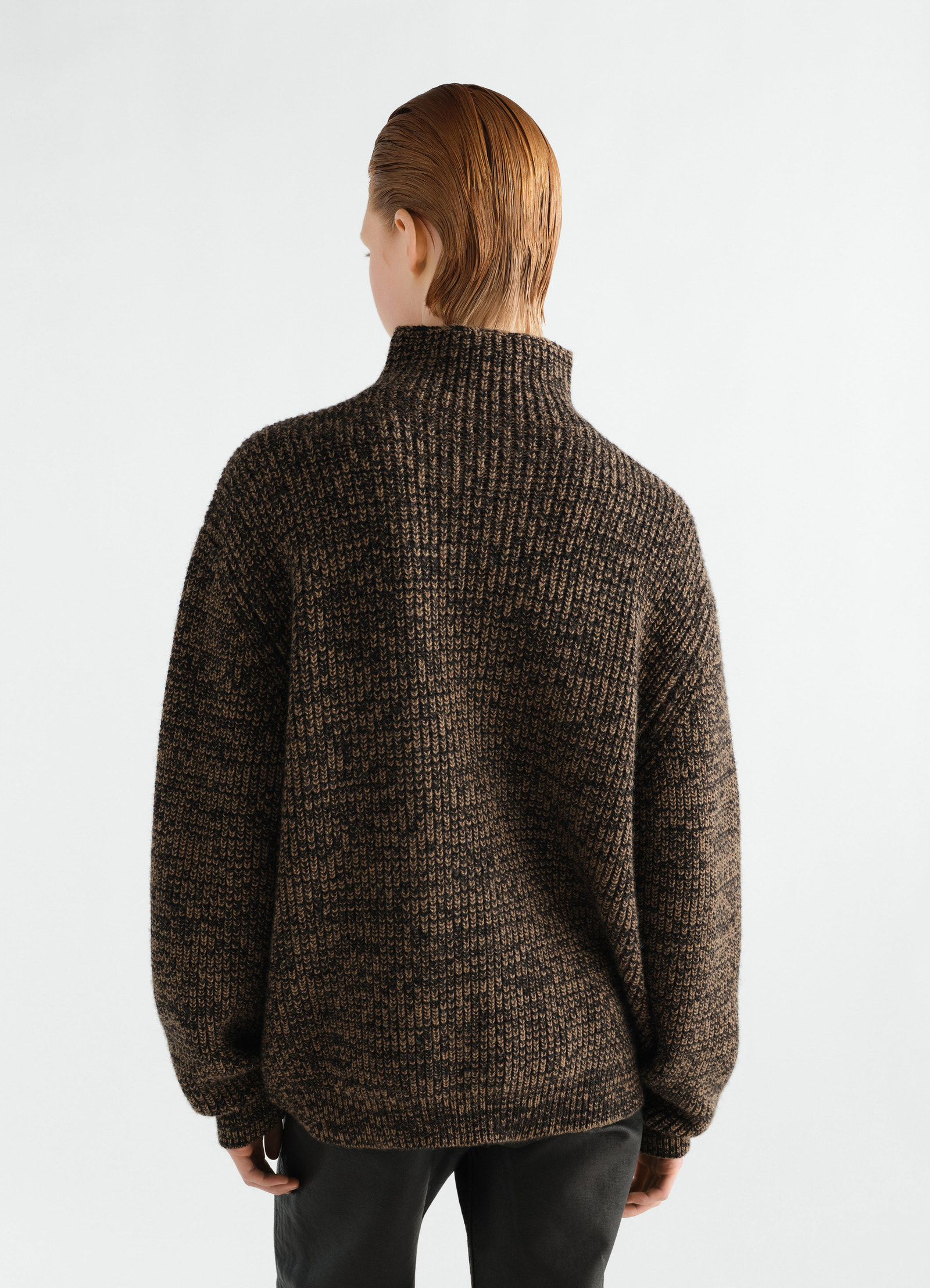 High neck brown and black yak alpaca knit sweater by lemaire worn by a model back view