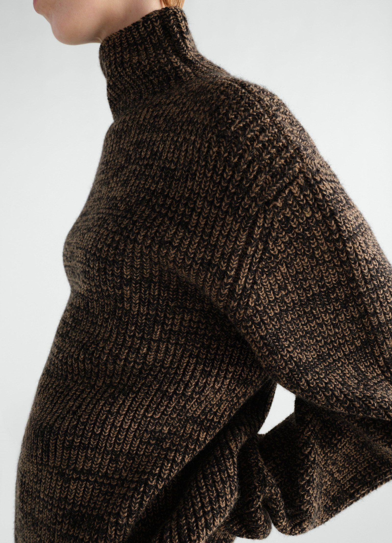High neck yak alpaca sweater in brown and black knit worn by model side view lemaire
